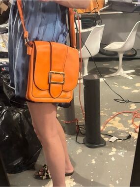 Orange leather bag with buckle